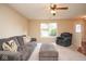 Comfortable living room with plush seating and a view to the backyard at 8047 Red Barn Cir, Indianapolis, IN 46239