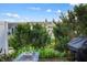 Backyard featuring greenery, a fire pit, and an outdoor grill at 9525 Longwell Dr, Indianapolis, IN 46240