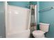 Clean bathroom featuring a bathtub with white enclosure and shower, and a toilet at 9525 Longwell Dr, Indianapolis, IN 46240
