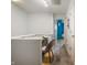 Hallway with wood floors, white walls, a desk, and an open doorway at 9525 Longwell Dr, Indianapolis, IN 46240