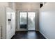 Bright kitchen featuring modern appliances, a sleek refrigerator, and sliding glass doors to the outdoor space at 9525 Longwell Dr, Indianapolis, IN 46240