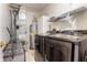 Bright laundry room with modern washer and dryer, water heater, and shelving at 9525 Longwell Dr, Indianapolis, IN 46240