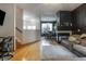 Open-concept living room with hardwood floors, fireplace, and dining area, perfect for entertaining at 9525 Longwell Dr, Indianapolis, IN 46240
