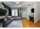 Bright living room featuring a plush sofa, stylish decor, and a ceiling fan for added comfort at 9525 Longwell Dr, Indianapolis, IN 46240