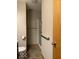 Bathroom view of accessible shower with safety bars and toilet at 989 Plaza Dr, Martinsville, IN 46151