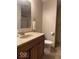 Bathroom featuring a neutral-colored vanity, toilet, and walk-in shower at 989 Plaza Dr, Martinsville, IN 46151
