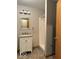 Bathroom view of vanity with framed mirror and walk-in shower at 989 Plaza Dr, Martinsville, IN 46151