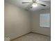 A neutral bedroom features carpeting, a ceiling fan, and a window with blinds at 989 Plaza Dr, Martinsville, IN 46151