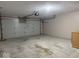 Garage featuring an automatic door and storage cabinet at 989 Plaza Dr, Martinsville, IN 46151