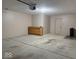 Garage view of automatic door, built in cabinet, and epoxy floor at 989 Plaza Dr, Martinsville, IN 46151