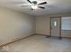 Neutral living room with carpet, ceiling fan, and natural light at 989 Plaza Dr, Martinsville, IN 46151