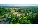 Overhead neighborhood shot displays expansive lot with mature trees at 10065 E 25Th St, Indianapolis, IN 46229