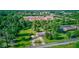 Aerial view shows property near commercial buildings with mature trees, and roadway at 10065 E 25Th St, Indianapolis, IN 46229