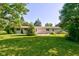 Expansive backyard with well-maintained lawn, offering ample space for outdoor activities at 10065 E 25Th St, Indianapolis, IN 46229