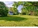 Expansive backyard with a shed, lush greenery, and plenty of space for outdoor activities at 10065 E 25Th St, Indianapolis, IN 46229