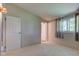 Comfortable bedroom featuring neutral walls, plush carpet, and an attached closet at 10065 E 25Th St, Indianapolis, IN 46229