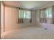 Serene bedroom with multiple windows, plush carpet, and soft natural light at 10065 E 25Th St, Indianapolis, IN 46229