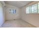 Bright bedroom featuring two windows that provide an abundance of natural light at 10065 E 25Th St, Indianapolis, IN 46229