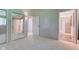 Bright bedroom with plush carpet, closet with mirrored doors, and an ensuite bathroom at 10065 E 25Th St, Indianapolis, IN 46229