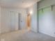 Bright bedroom featuring neutral carpeting, and a closet with bifold doors at 10065 E 25Th St, Indianapolis, IN 46229