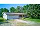 Charming home with a garage, well-maintained lawn, and inviting curb appeal at 10065 E 25Th St, Indianapolis, IN 46229