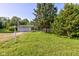 Charming single-story home with an attached garage and a lush green lawn at 10065 E 25Th St, Indianapolis, IN 46229