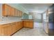 Well-designed kitchen offering sufficient cabinetry, bright countertops, and an efficient layout at 10065 E 25Th St, Indianapolis, IN 46229