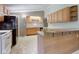 Functional kitchen featuring ample cabinet space, countertop area, and practical appliances at 10065 E 25Th St, Indianapolis, IN 46229