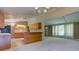Open living area with light, neutral walls, and natural light, seamlessly connecting the kitchen at 10065 E 25Th St, Indianapolis, IN 46229