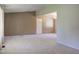 Spacious living room featuring neutral walls, plush carpeting, and ample natural light at 10065 E 25Th St, Indianapolis, IN 46229