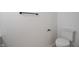 Bright bathroom featuring a toilet and modern black towel rack at 10222 Arapahoe Dr, Indianapolis, IN 46235
