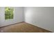 Cozy bedroom with natural light filtering through the window at 10222 Arapahoe Dr, Indianapolis, IN 46235
