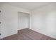 A bedroom with carpet flooring and a closet with a shelf and rack to hang clothes at 10222 Arapahoe Dr, Indianapolis, IN 46235