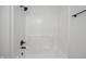 Modern bathtub and shower feature sleek, matte-black hardware, and a bright, white, easy-to-clean surround at 10222 Arapahoe Dr, Indianapolis, IN 46235