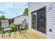 Charming backyard with a wooden deck, stylish patio furniture, and lush greenery, ideal for relaxation and enjoyment at 1106 Barbara Dr, Greenwood, IN 46143
