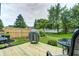 Beautiful backyard with a wooden deck, well-manicured lawn, and a modern grill, perfect for outdoor entertaining at 1106 Barbara Dr, Greenwood, IN 46143