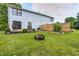 Spacious backyard with a deck, grill, garden boxes and firepit for outdoor enjoyment at 1106 Barbara Dr, Greenwood, IN 46143