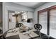 Charming dining room features a table for four with black chairs and white cabinets at 1106 Barbara Dr, Greenwood, IN 46143