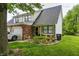 Charming two-story townhouse with brick and siding, a well-manicured lawn, and a one-car garage at 1106 Barbara Dr, Greenwood, IN 46143
