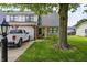 Charming two-story townhouse featuring a well-manicured lawn and private garage at 1106 Barbara Dr, Greenwood, IN 46143