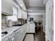Bright kitchen with white cabinets, modern appliances, and a view of the dining area at 1106 Barbara Dr, Greenwood, IN 46143