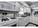 Well-maintained kitchen featuring white appliances, a gas stove, and efficient layout at 1106 Barbara Dr, Greenwood, IN 46143