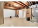 Unfinished basement with tile flooring and exposed beams, ready for customization at 11250 N 600 W, Fountaintown, IN 46130