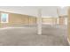 Large basement with carpet flooring, neutral walls, recessed lighting, and support columns, offering versatile possibilities at 11250 N 600 W, Fountaintown, IN 46130