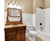 Bathroom with beadboard walls, wood vanity, and a shower tub at 11250 N 600 W, Fountaintown, IN 46130