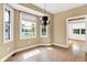 Cozy dining area with windows, a unique chandelier, and neutral walls at 11250 N 600 W, Fountaintown, IN 46130