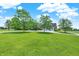 Expansive green front yard leading to a home with a three-car garage and circular driveway at 11250 N 600 W, Fountaintown, IN 46130
