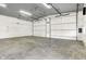 Massive white garage space featuring polished concrete floors, overhead lighting, and abundant storage capacity at 11250 N 600 W, Fountaintown, IN 46130