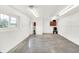 Spacious garage with white walls, polished concrete floor, bright lighting, and peg board ready for your organization at 11250 N 600 W, Fountaintown, IN 46130