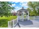 Beautiful gazebo overlooking the backyard with a red and white barn, perfect for relaxation at 11250 N 600 W, Fountaintown, IN 46130